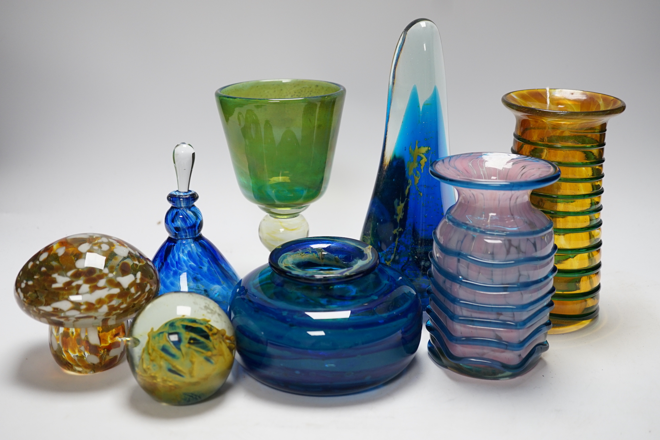 A group of Mdina glass comprising three vases, a stemmed glass, three paper weights and a scent bottle and stopper, (8) tallest 22cms high